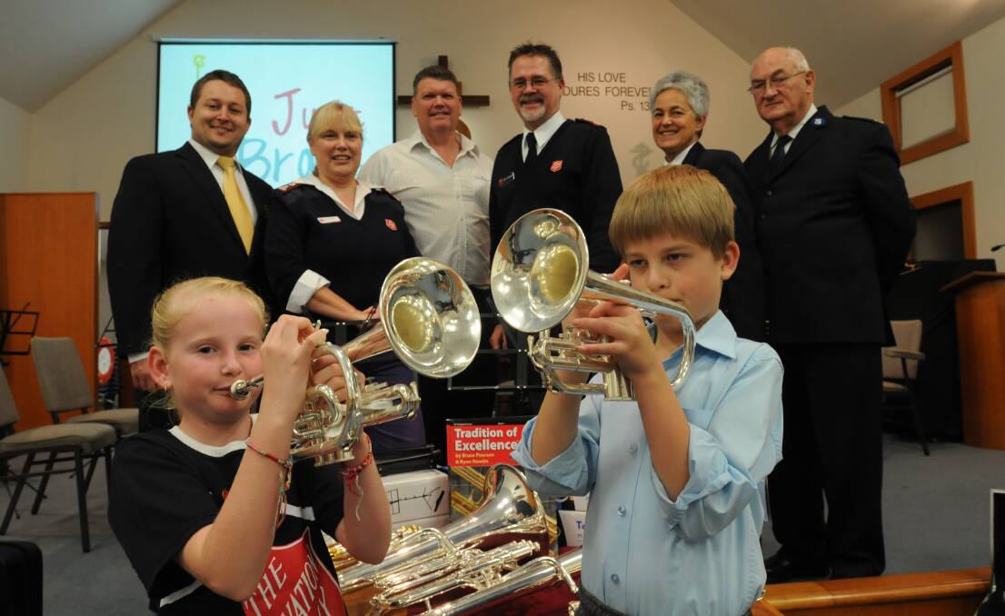 NEW INSTRUMENTS: Just Brass participants (front) Isobel Burton and Isaac Saunders and (back) City of Orange Brass Band’s Matthew Gately, Salvation Army Major Karen Saunders, Kleenheat Gas representative Geoff Hill, Salvation Army Major Greg Saunders, Kathy Gott and George Godkin.