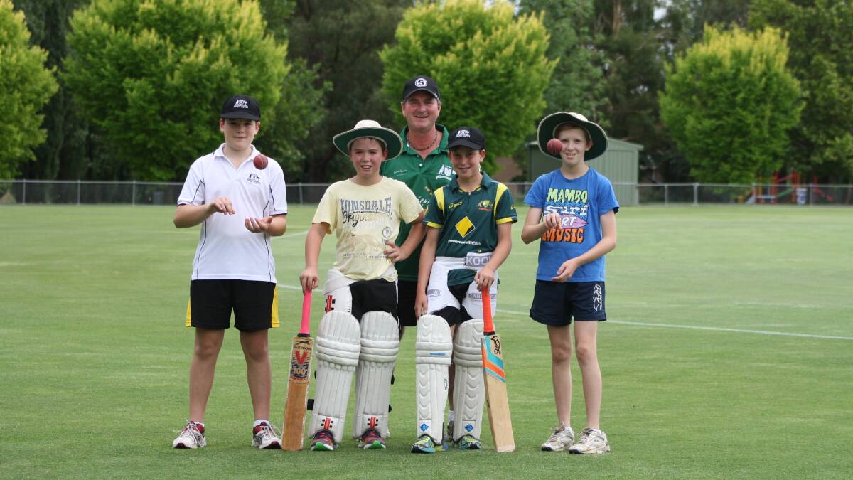FIRED UP: Mitchell’s Lachlan Coyte, Blake Weymouth, Frank Weymouth (co-coach), Hugh Middleton and Tommy Pearce are ready for the Western NSW under 13 cricket carnival starting today. Photo: MICHELLE COOK 0104mccricket