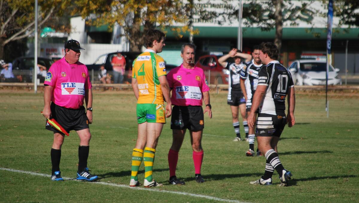 OFFICIALLY THE BEST: Dale Harding, pictured centre speaking to CYMS and Cowra skippers Ben McAlpine and Ron Lawrence, won Group 10's Referee of the Year for 2015. Photo: PETE GUTHRIE