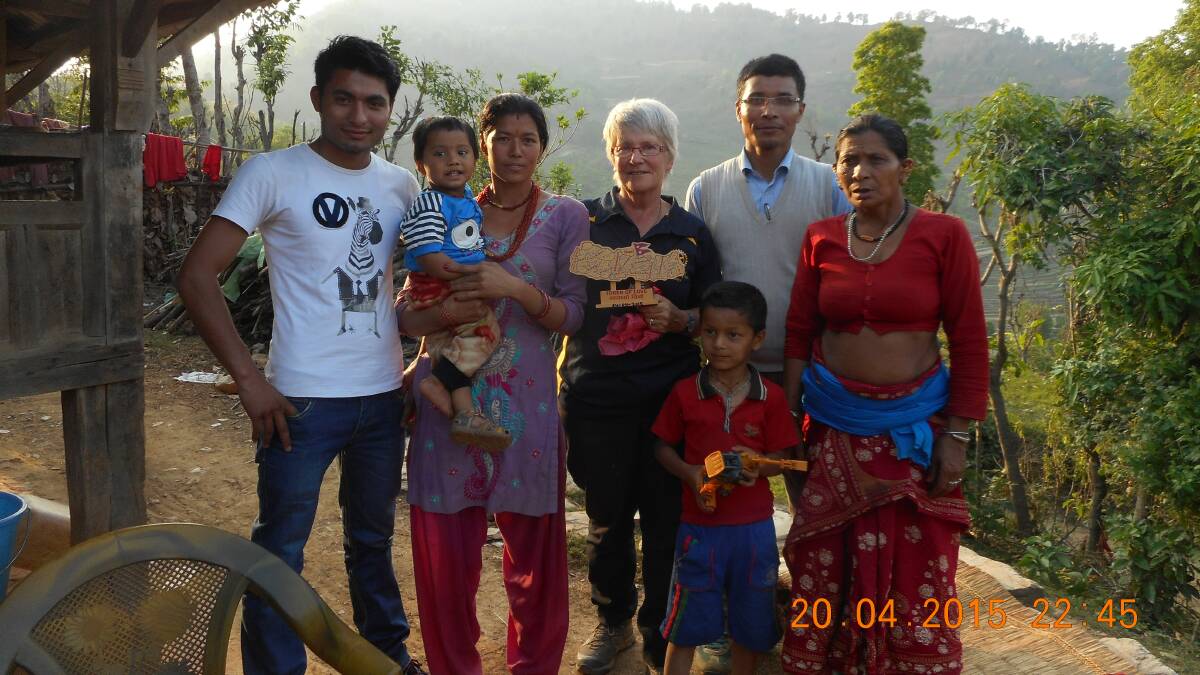 MEETING THE FAMILY: Mary Brell of Orange (centre) with Nepalese teacher Buddhiman Shrestha (second right) and his family in Nepal five days before the earthquake hit last month. 0516tmMaryBrell2