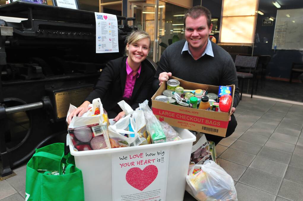 GIVING AND RECEIVING: Central Western Daily journalists Danielle Cetinski and Matt Findlay.
