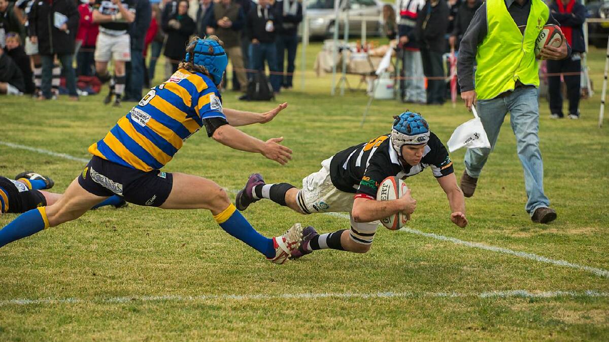 IN THE CORNER: Molong flyer Joe Doyle crashes over for a try this season. Photo: BR Photography.