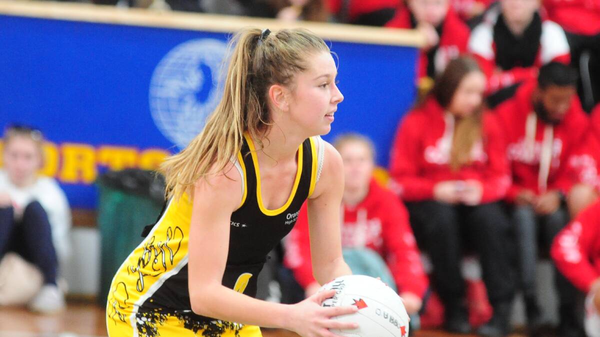 CENTRE OF ATTENTION: Orange High centre Alex Kennedy looks down the court during her side's 47-25 win over Dubbo in the Astley Cup girls' netball yesterday. Photo: DAILY LIBERAL