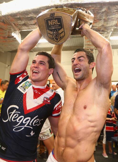 GOOD TIMES: Daniel Mortimer (left) and Sydney Roosters captain Anthony Minichiello celebrate winning the 2013 NRL grand final. Photo: GETTY IMAGES