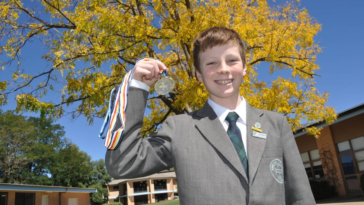 GOLDEN RUN: Oliver McLaughlin won gold at the PSSA swimming championships in the 12-13 years 50m backstroke. Photo: NICK McGRATH 0327nmoliver1