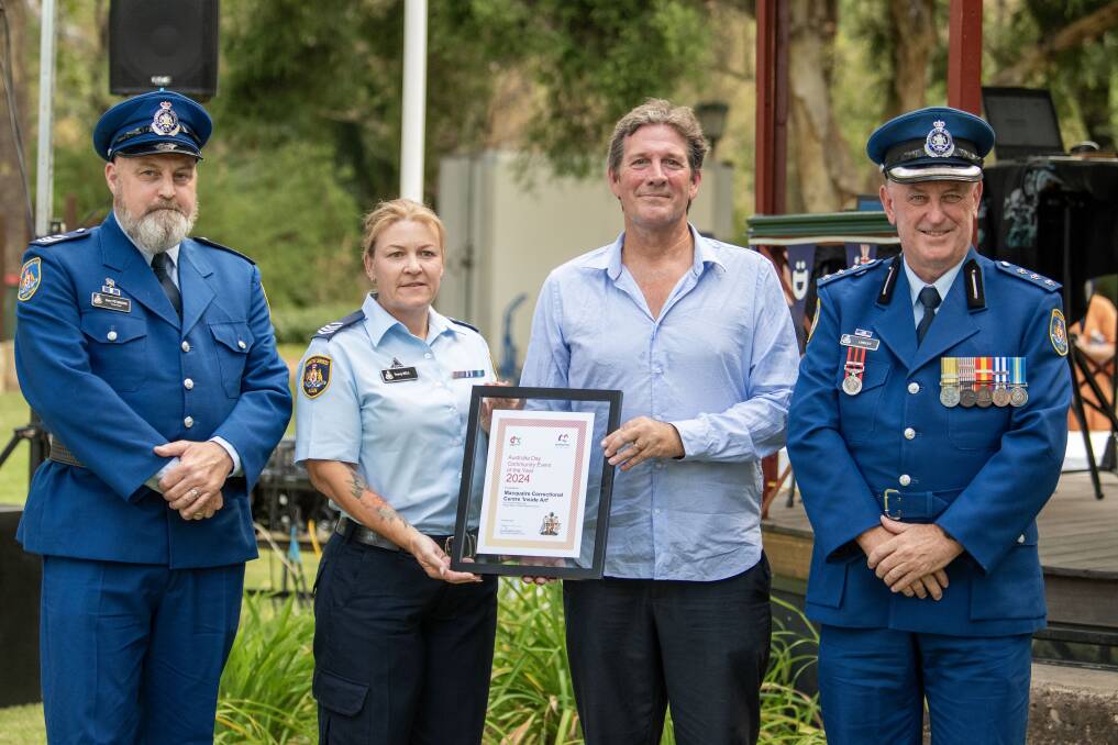 Wellington Australia Day ambassador Rhys Muldoon presenting Macquarie Correctional Centre staff Gary Peterson, Tracey Bell and Philip Lindley with the award. Picture by Belinda Soole 