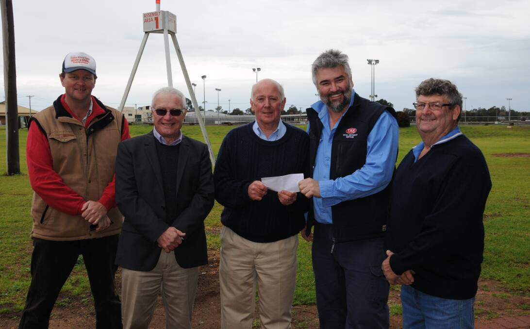 CHARITABLE DONATION: Terry Mitchell, Chris Edwards with Alex Ferguson, who accepted a cheque for Lifeline Central West from Black Dog Ride's Wayne Amor, alongside Marty Morris. Photo: ORLANDER RUMING