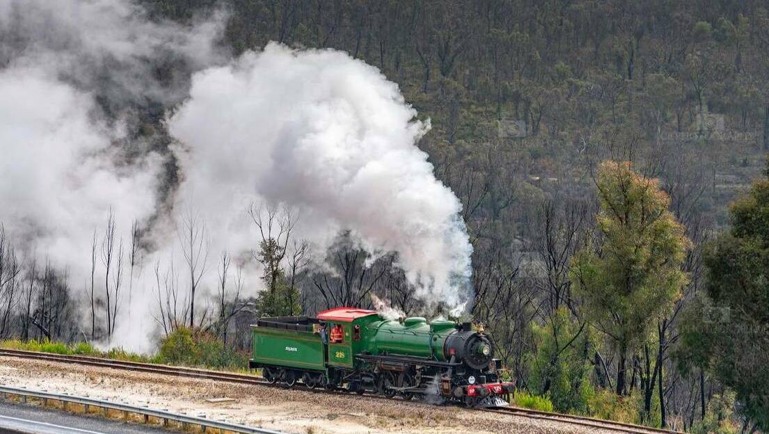  ALIVE AGAIN: Steam covered the air as the locomotive went around the tracks. Picture: CHRIS LITHGOW
