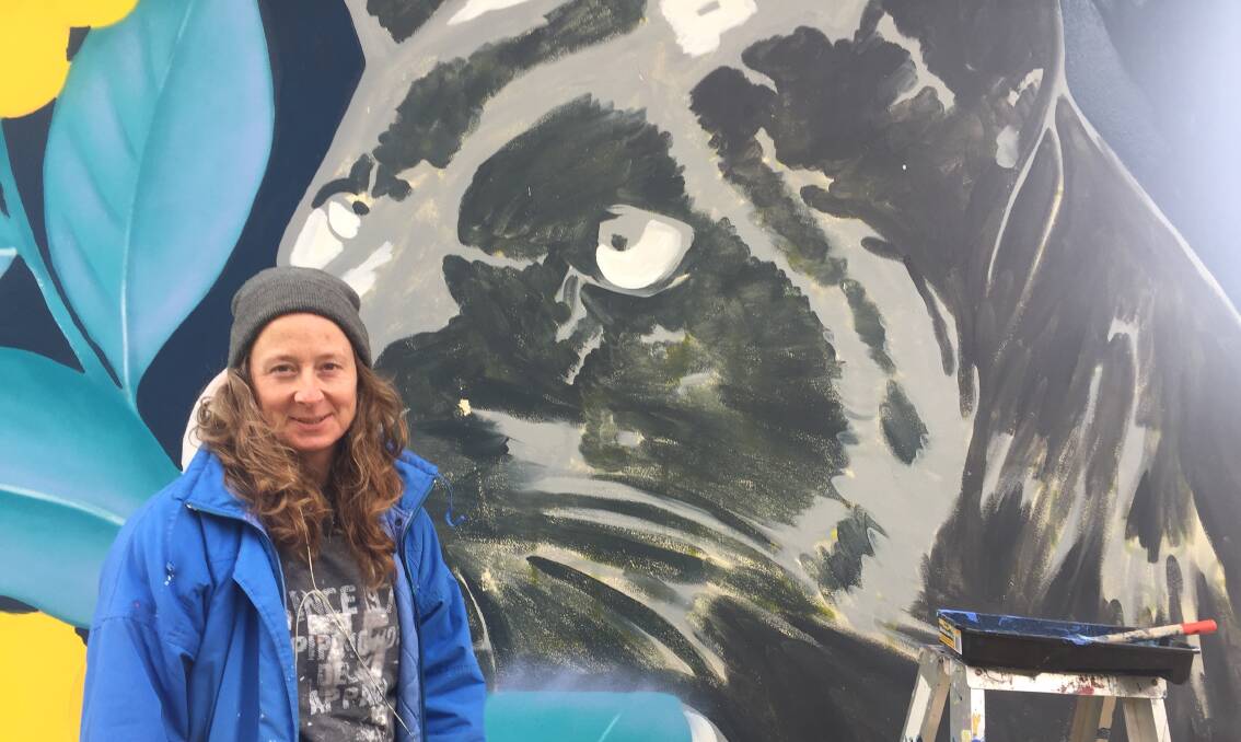 Artist Mandy Schone-Salter on Friday in front of the nearly-completed mural. Photo: Reidun Berntsen