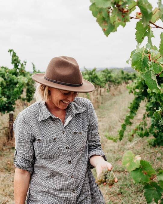 Sarah Yeates among the grape vines. Supplied