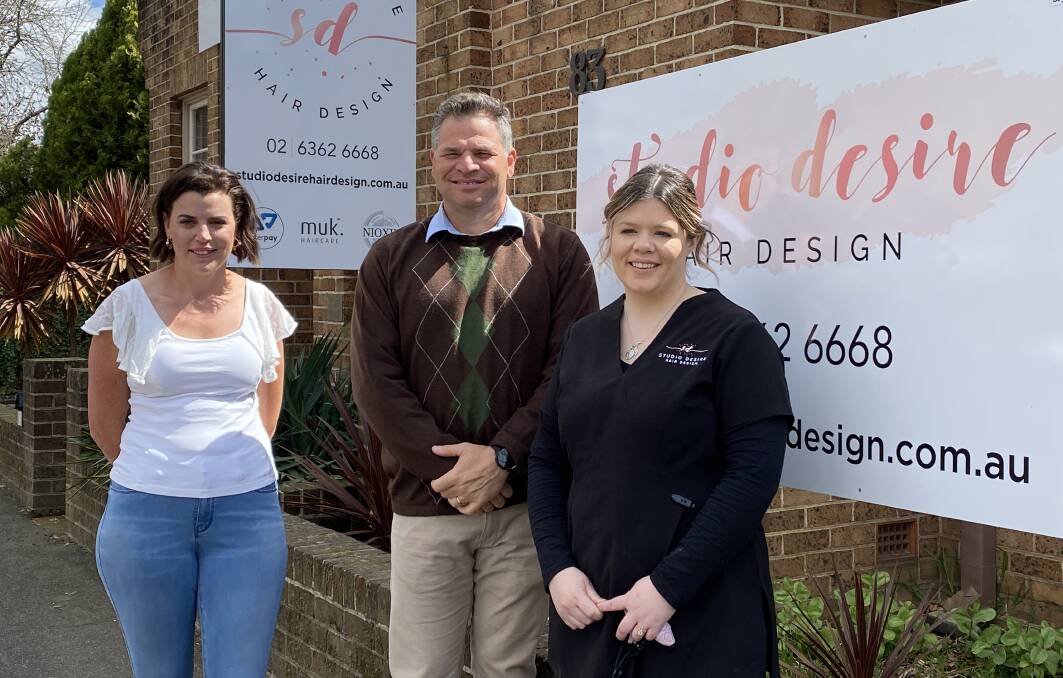 Phil Donato with hairdressers Jessica Lemrock (left) and Teagan Wing (right) whose businesses will be unfairly limited compared to other businesses when restrictions ease at 70 per cent double-dose vaccination.