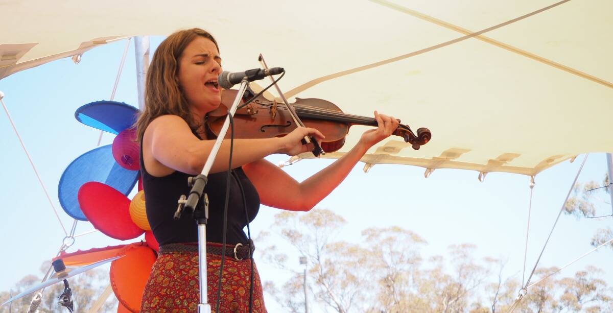 CROSSING OVER: Musician Amy Stevens performing under her stage name 'Amy Viola' at last weekend's Inland Sea of Sound festival. Photo: SAM BOLT 120118sbamyv1