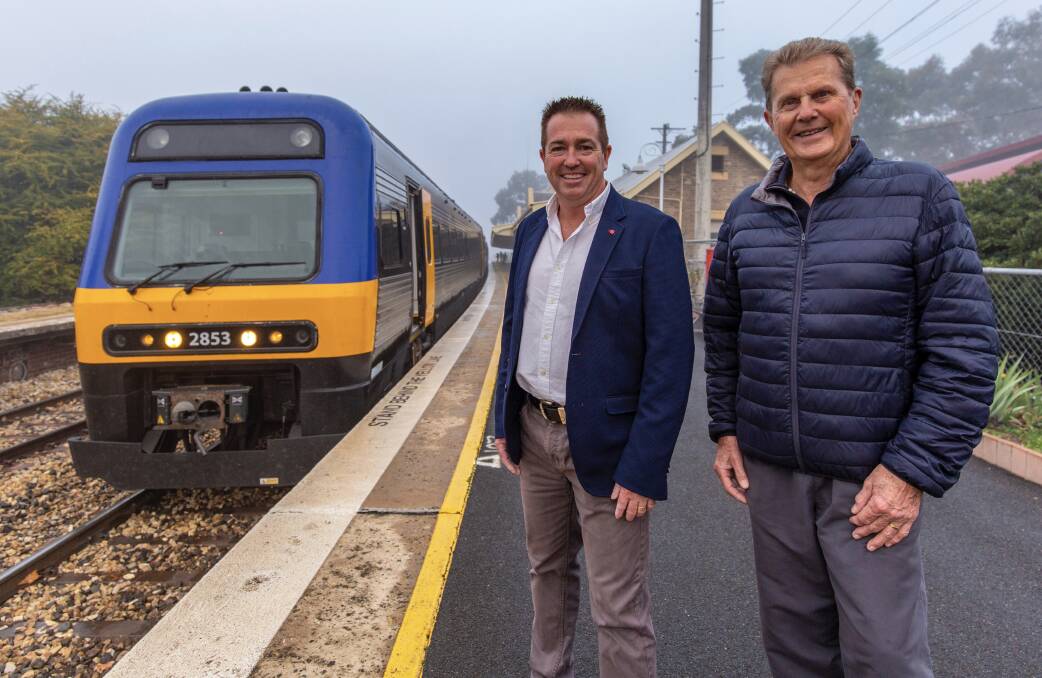 TWO'S COMPANY: Member for Bathurst Paul Toole with Bathurst Rail Action Group chairman John Hollis and the existing Bathurst Bullet. Photo: SUPPLIED