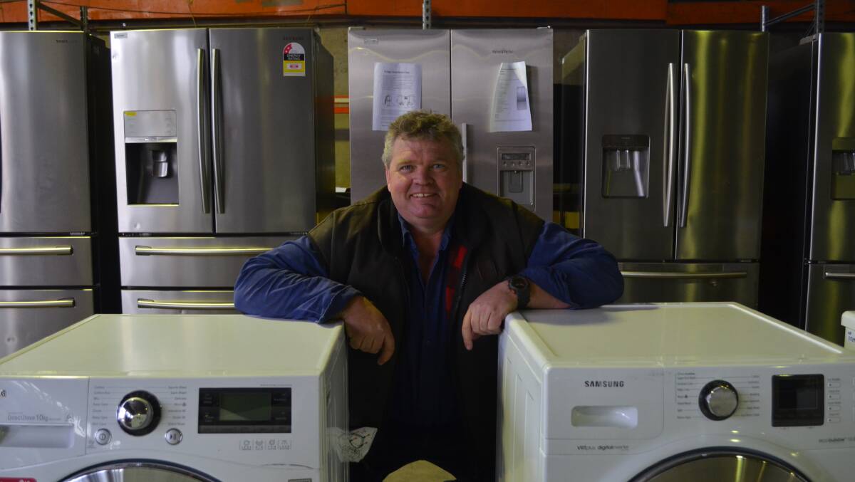 POPULAR: Burns Auctions owner Scott Burns with some of the whitegoods, which will go under the hammer on Sunday in Orange. Photo: DECLAN RURENGA 0714drauction1
