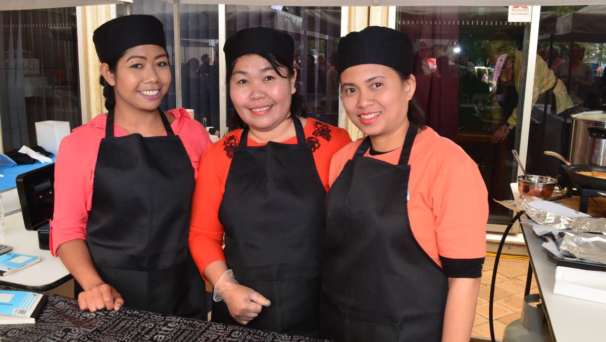 Eka Palmer, Fifi Saragih and Ika Cahyani cook up Indonesian delicacies during Orange Masala. Photo: DECLAN RURENGA 1014drmasala1