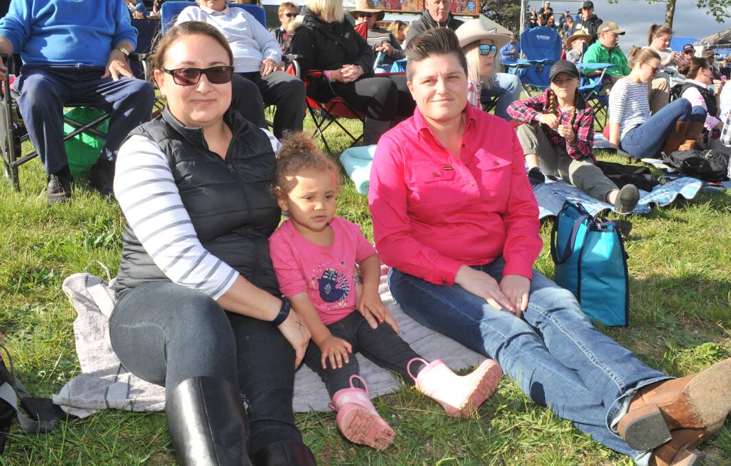ATMOSPHERE: Annelene, Vian and Sarah Zeelie enjoy the action at the rodeo. Photo: JUDE KEOGH 1014jkrodeonews1