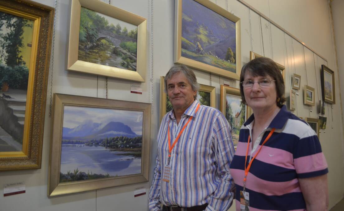 NOT TOOLS OR TRACTORS: Glenn and Fiona Morton at the Morton Gallery exhibition at the Bert Whiteley Pavilion at the Australian National Field Days. Photo: DECLAN RURENGA 1028drfield3