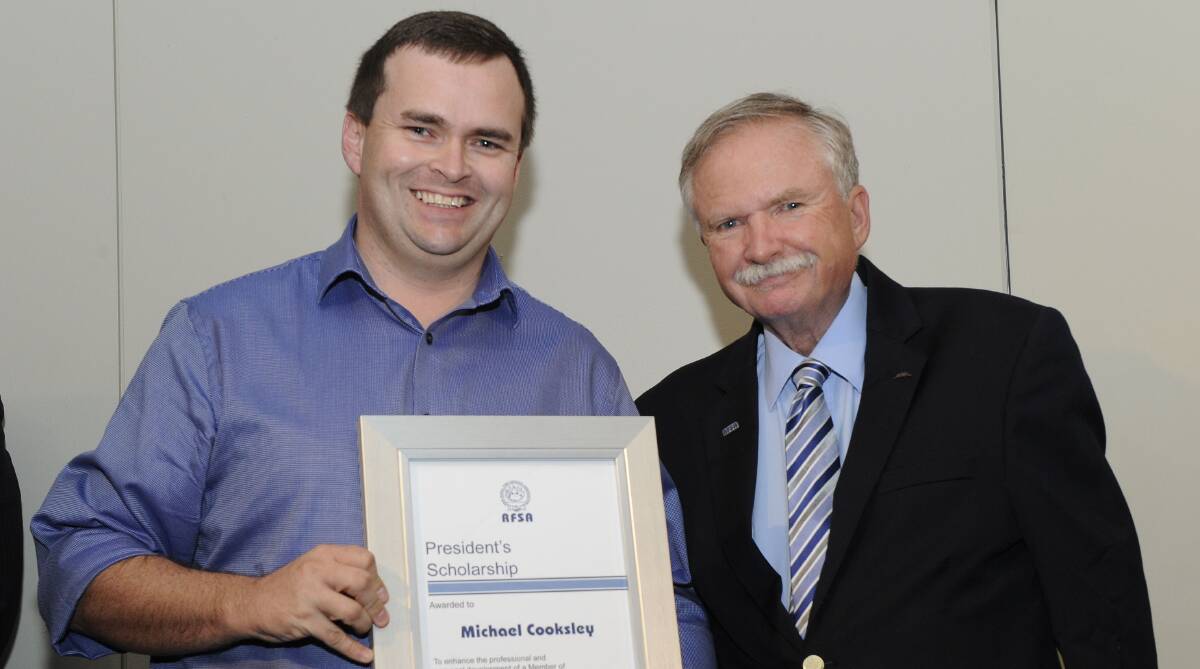 PROFESSIONAL LEARNING: Volunteer firefighter Michael Cooksley with RFSA president Ken Middleton. Photo: CONTRIBUTED