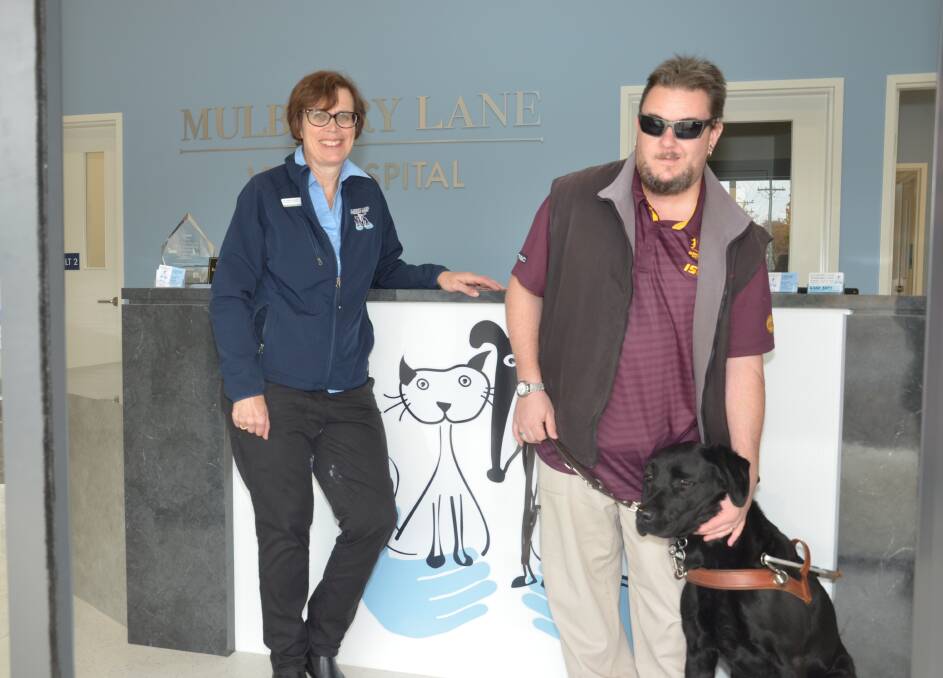 Mulberry Lane Veterinary Hospital's Judith Carney and Matt Bryant and Bronco at the hospital's open day.