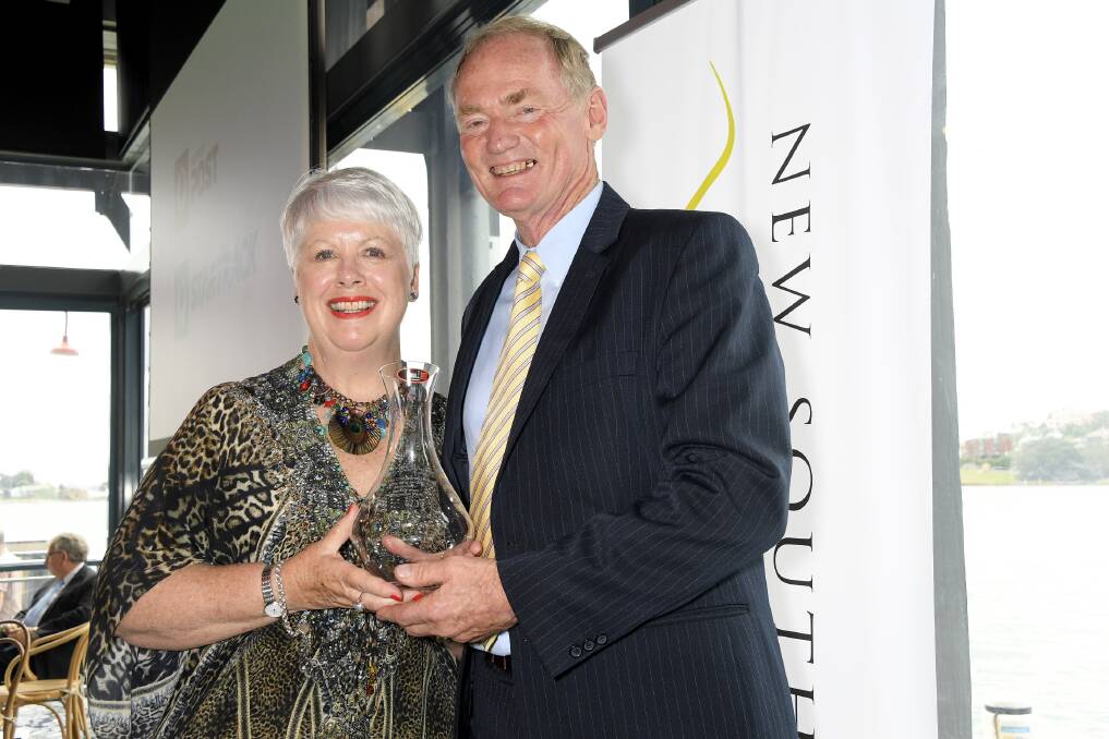 CHUFFED: Montoro Wines' Jennifer and Bob Derrick collect the trophy for best mature red at the NSW Wine Awards in Sydney. Photo: CONTRIBUTED