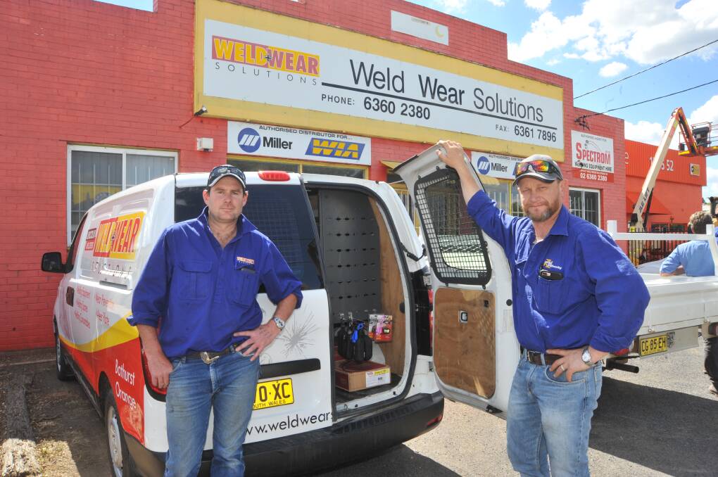 WARNING: Weld Wear Solutions building has been closed due to asbestos but Ben Perriman and Matthew Still are still working. Photo: JUDE KEOGH 1108jkweld2