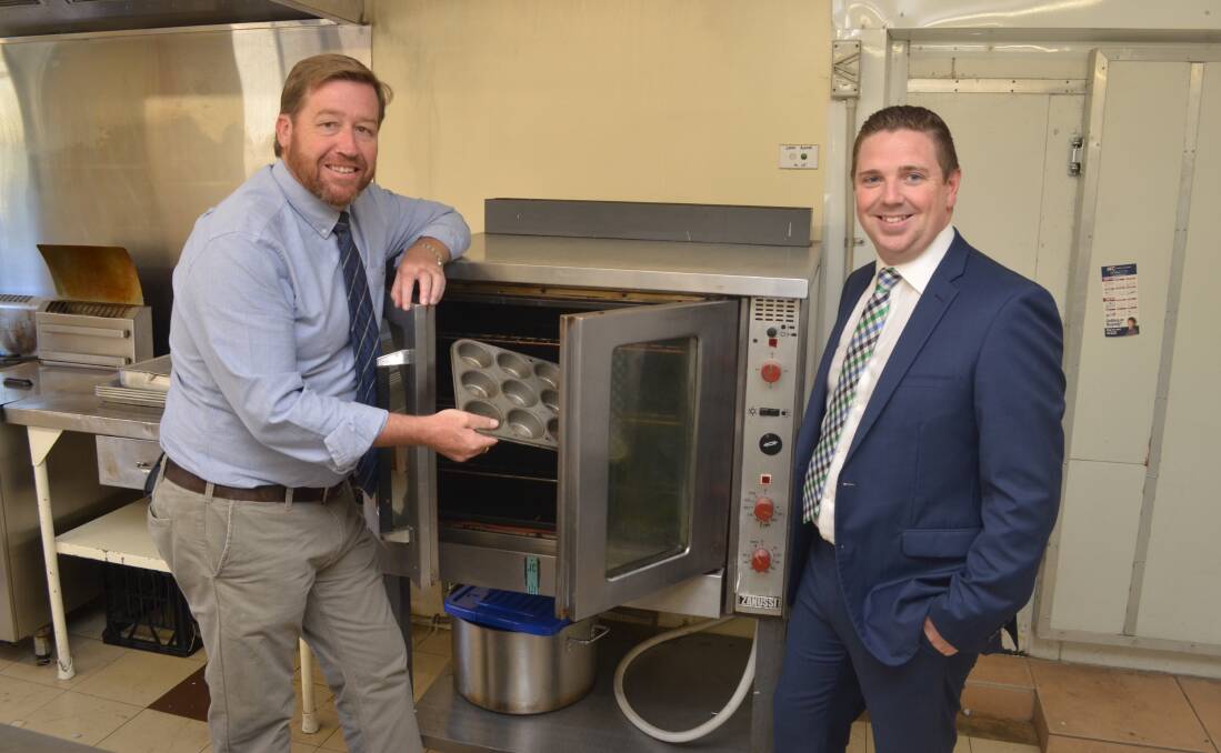 READY TO EAT: NSW Police Minister Troy Grant and Molong RSL Club president Jamie Jones at the announcement of ClubGrants funding for the club. Photo: DECLAN RURENGA