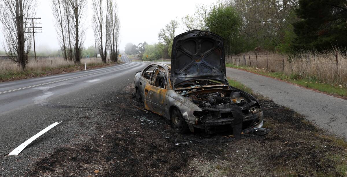 NO LUCK: A Holden VT Commodore which broke down on Huntley Road was torched by vandals on Sunday. Photo: ANDREW MURRAY 1007amcar17771
