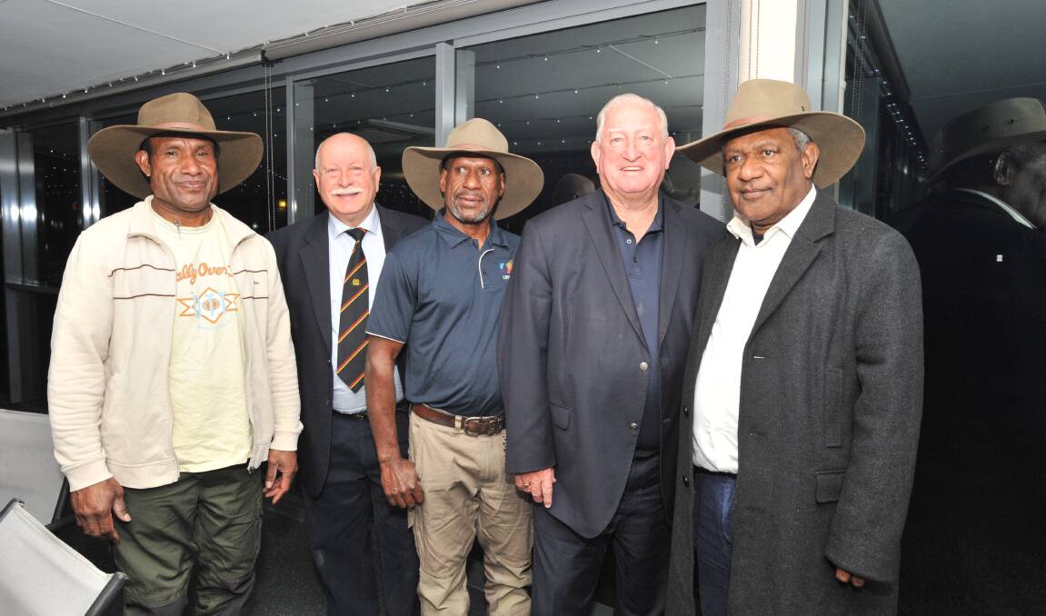 Michael Elpeno (left) and Paul Foki (centre) are farewelled by Chris Gryllis, mayor John Davis and PNG Consul General Sumasy Singin. Photo: JUDE KEOGH 0526jkpng2