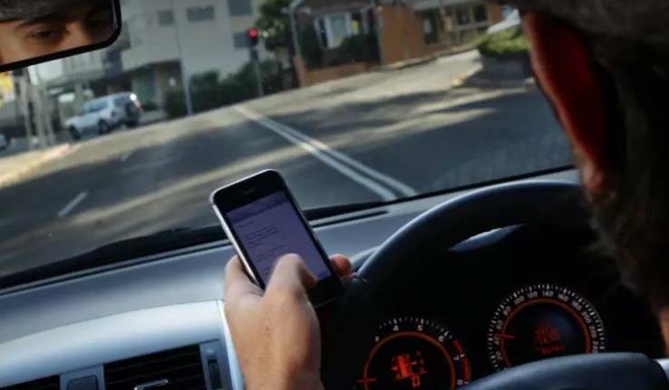 FINE TIME: Drivers will lose five points for illegal use of a mobile phone. Photo: KEN ROBERTSON