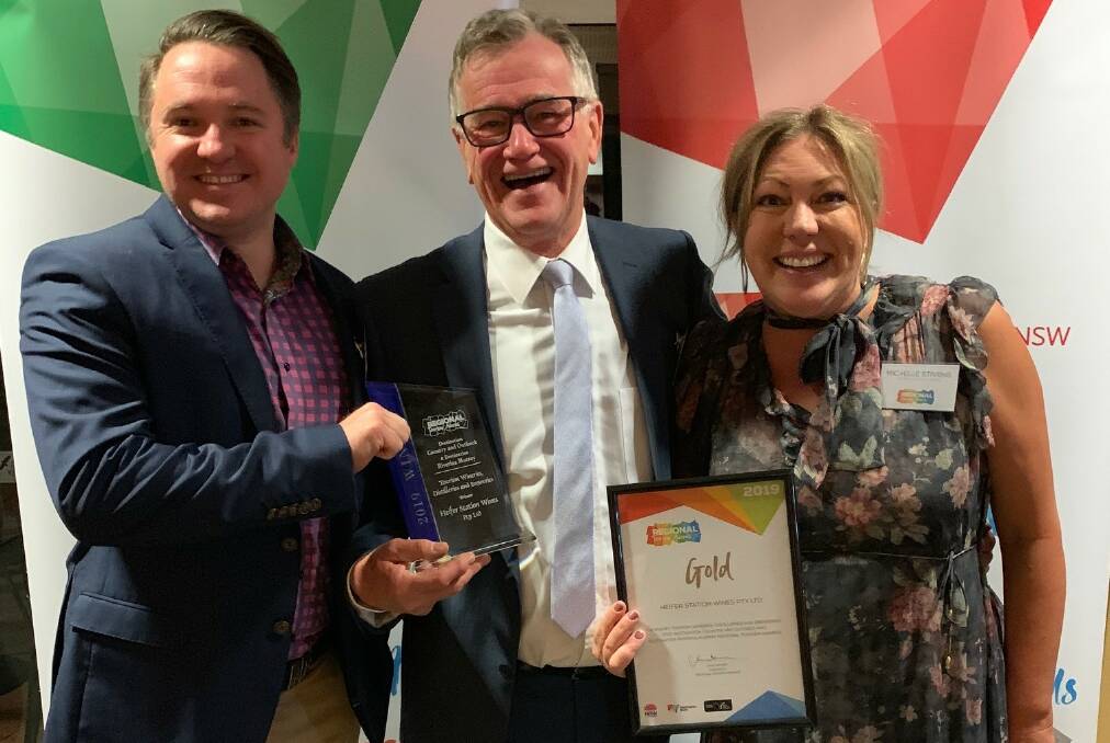 WINNERS ARE GRINNERS: Heifer Station's James Thomas with Phillip and Michelle Stivens won gold at the 2019 awards.