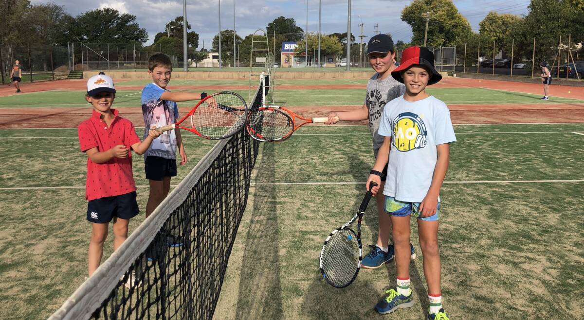 TOUCHING RACKETS: Beau Gardner, Billy Rollin, Ollie and Sam Rollin touched rackets last week instead of shaking hands. Photo: CHRISSIE KJOLLER.