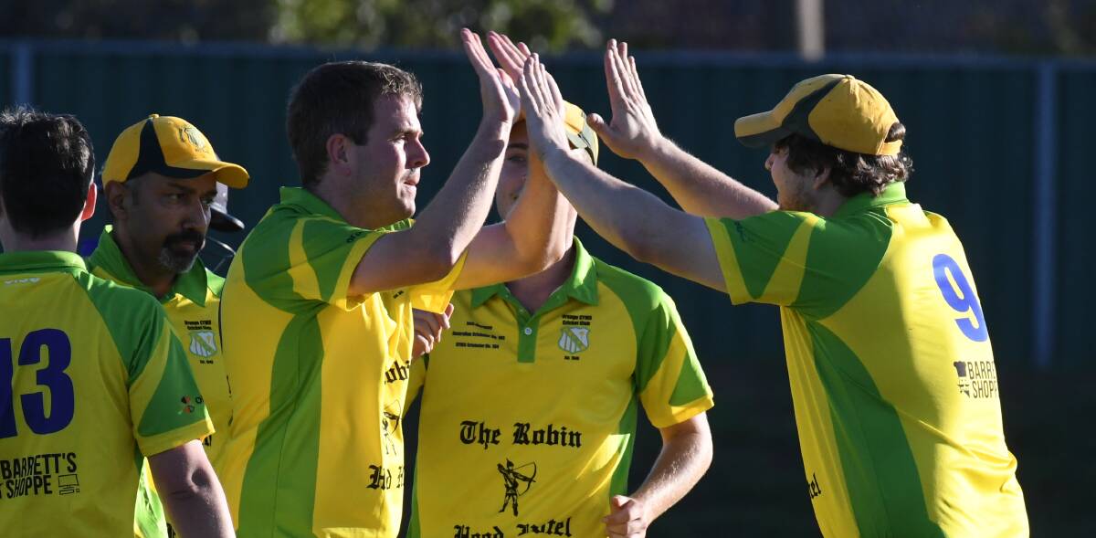 READY TO GO: Tom Belmonte (right) embraces with skipper Hugh Le Lievre during a Bathurst Orange Inter District Cricket fixture last summer. Photo: JUDE KEOGH