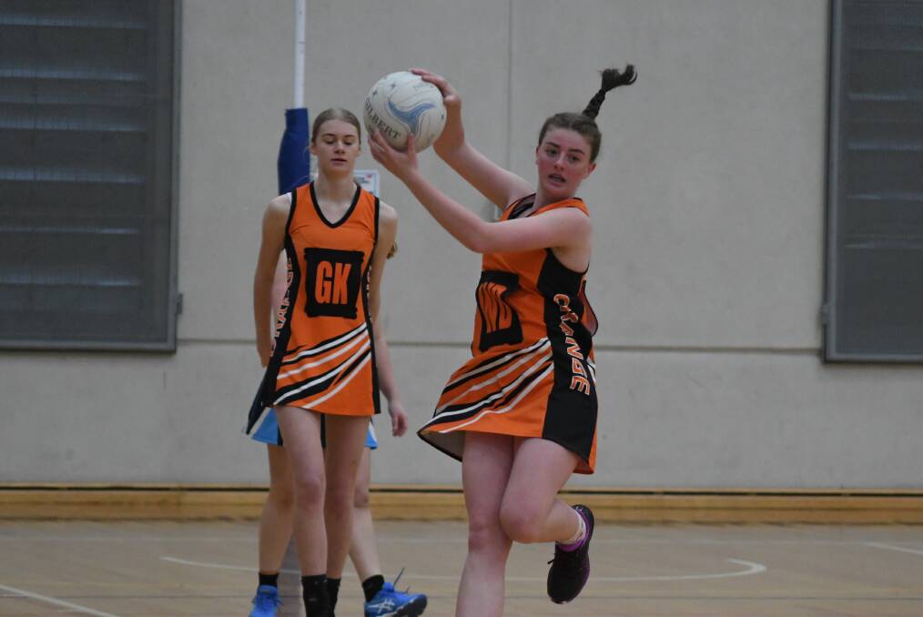Action from round four of the Orange Netball Association A-grade competition. Photos: CARLA FREEDMAN
