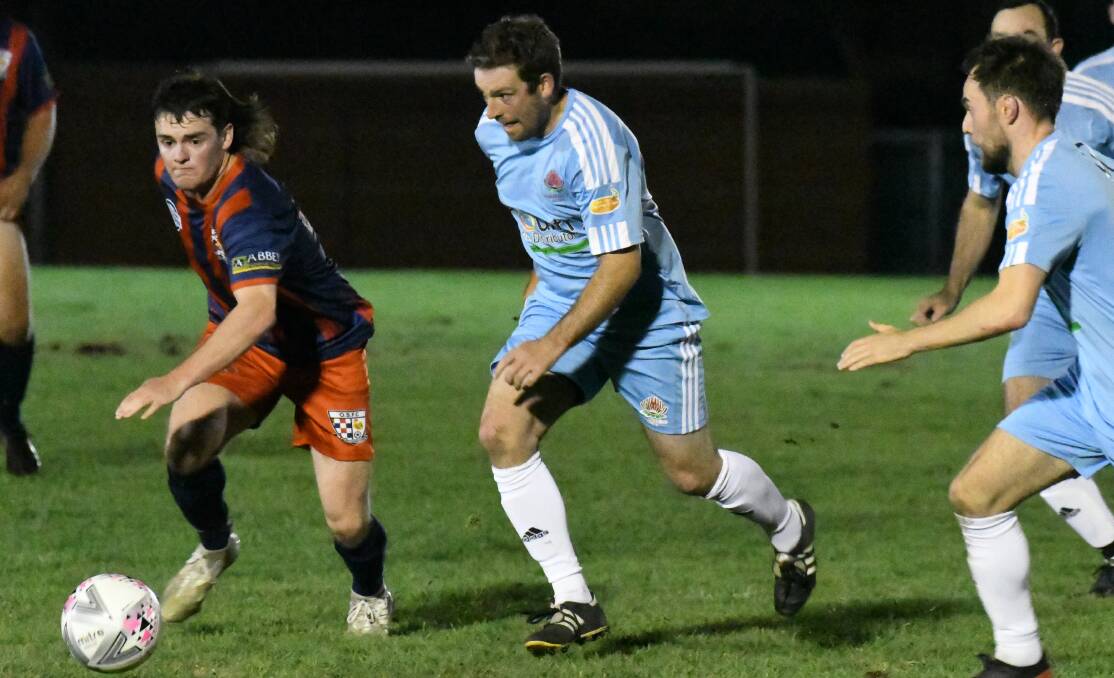 IN-FORM: Waratahs forward Craig Sugden in action during his side's 3-1 victory over Orana Spurs on Saturday night. The sky blues stand alone in first position after five rounds of WPL action. Photo: JUDE KEOGH