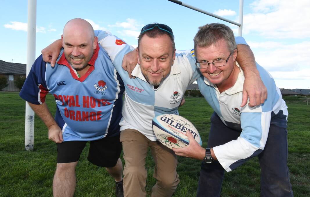 THE BOYS: Dave Haggar, Michael Page and Neil Bollinger played for Waratahs' rugby club in the 90s and 2000s. Photo: JUDE KEOGH