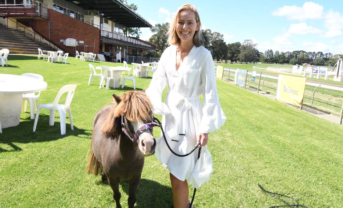 READY TO GO: Bonnie the pony, as well as Racing Orange executive officer Bree McMinn is hoping for a bumper turnout at Towac Park for Saturday's Ladies Race Day. Photo: JUDE KEOGH