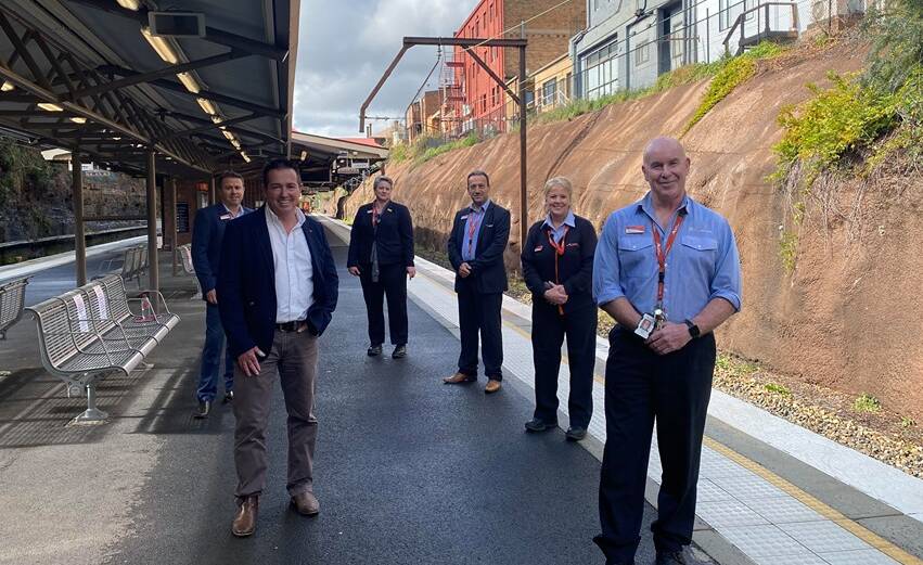 BACK ON TRACK: Minister for Regional Transport and Roads Paul Toole with NSW TrainLink director for southwest Michael Dorrain, west area manager Tiffany Glasgow, south west associate director Mark Kourouche, Lithgow staff manager Jo Hall and Lithgow station manager Pat Wall. : ALANNA TOMAZIN