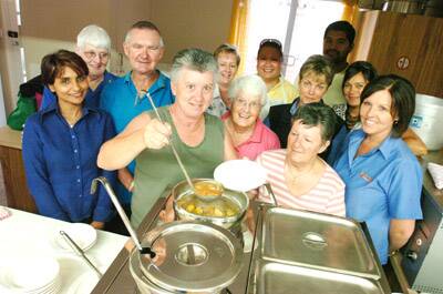 HELPING HAND: Volunteers and officials helped launch the St Vincent de Paul Society soup kitchen in Orange yesterday.