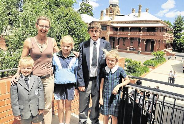 FAMILY TIES: Kinross Wolaroi School teacher Catherine Litchfield and her children Jock, Alice, Charles and Phoebe have a long connection with the school, which celebrates 125 years this weekend.      Photo: JUDE KEOGH 1103kws3