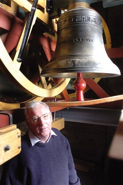 DING DONG: Father Frank Hetherington inside the bell tower of Holy Trinity Church in Anson Street which has been the subject of half a million dollars of maintenance works.