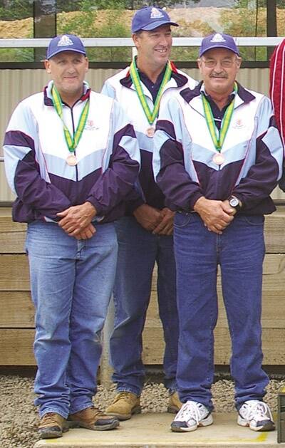 ON TARGET: Orange’s Dave Oates (left), Dean Brus and Max Wicks brought home a number of medals from the recent ISSF/Pistol Australia National Championships.