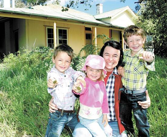 WORTHY WIN: Cumnock’s Christine Weston, pictured with her children Charlie,Toby and Skye, at a rundown farmhouse near the town, has been named NSW Woman of the Year.