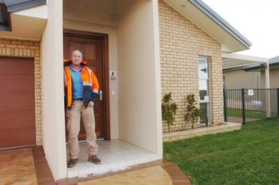 GREEN HOUSE EFFECT: Builder Mick Fabar at one of his environmentally friendly homes.