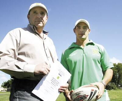 SIGNED ON: Orange CYMS president Ray Agland with the club’s new captain-coach Michael Sullivan yesterday.