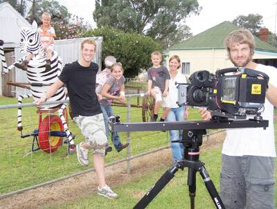 GETAWAY TO CUMNOCK: Ben, Jessica, Lachlan and Jacqui Hiller show Getaway host Jules Lund and audio operator Grant Beed their sculpture.