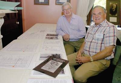 FAMILY TREE: Robert Bruce and chairman of the Dalton Genealogical Society Michael Neale Dalton trace their family history at the society’s gathering in Orange on Saturday.