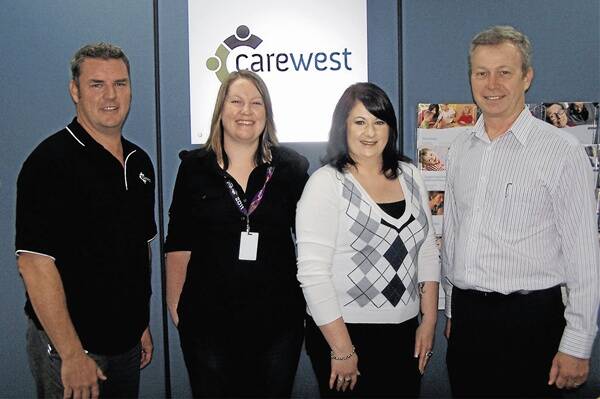 COMMUNITY WAGE BOOST: Fair Work Australia’s decision to award community workers with a significant pay increase was welcomed by CareWest staff Chris Ellem, Dana Campbell, Tanya Fichera and Marc Bonney. Photo: MICHAEL GLENN                                                    0202carewest3