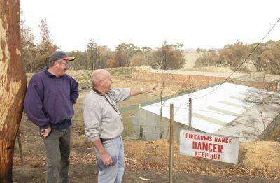 HOME ON THE RANGE: Orange and District Pistol Club committeeman Max Wicks and president Roger Bond inspect part of the club’s shooting range.