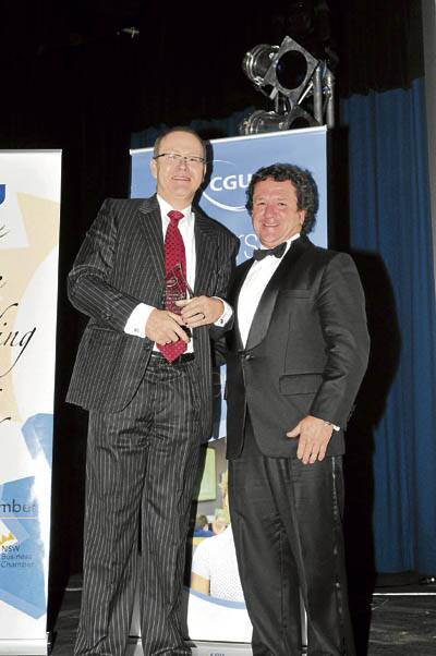 Orange watchmaker Daniel Fock is presented with his award by Chris Morrison from the Orange Business Chamber.