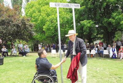 Mayor of Blayney, Ted Wilson congratulates Kurt Fearnley after they both unveiled the new Kurt Fearnley Park sign.